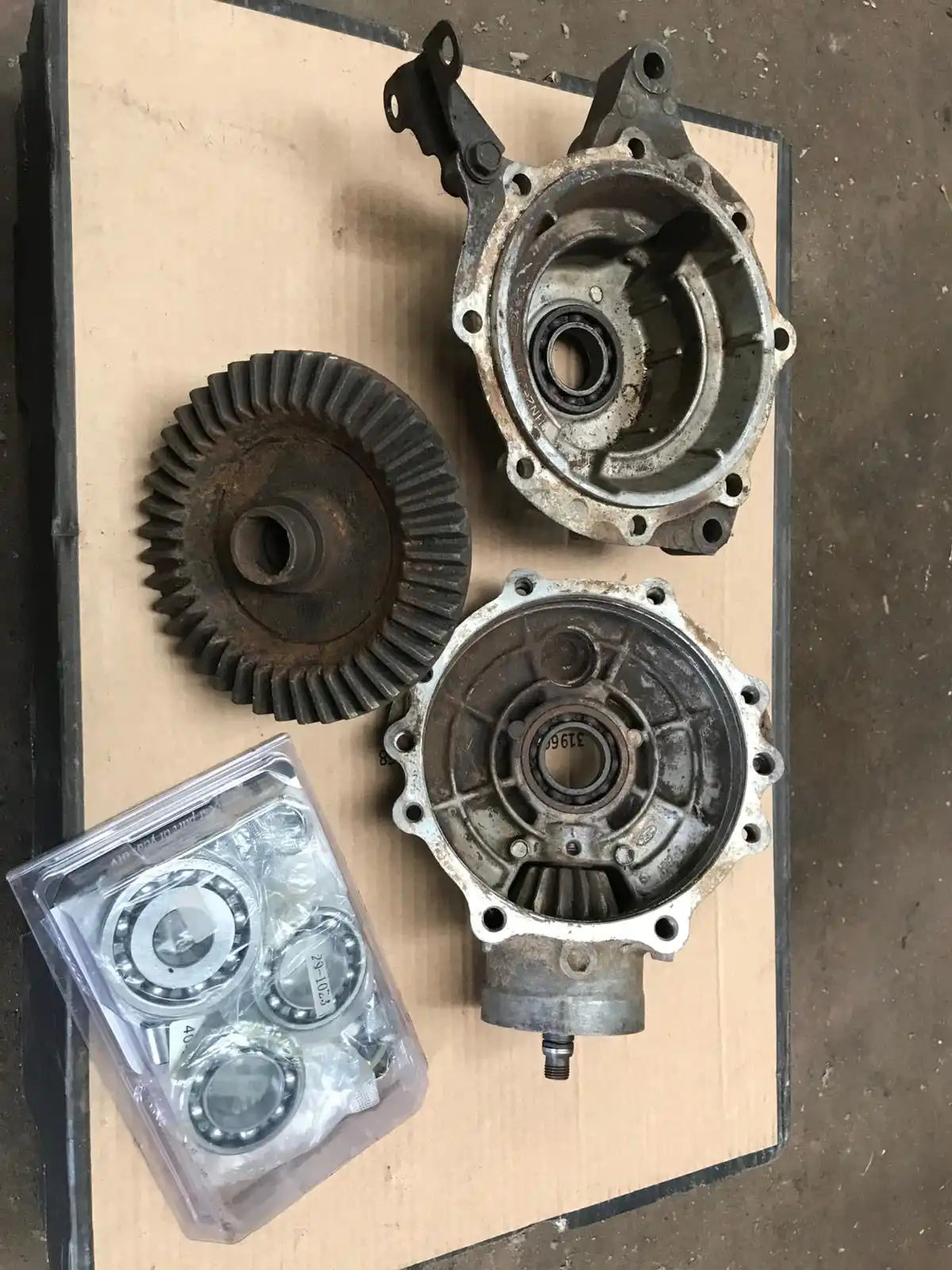 4-speed transmission kit with gears and bearings, silver metal.
